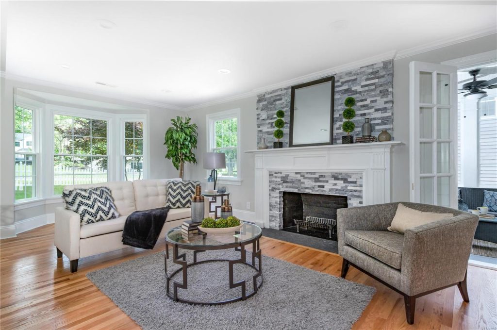 This is a living room remodel with a stone fireplace in Kirkwood, Missouri
