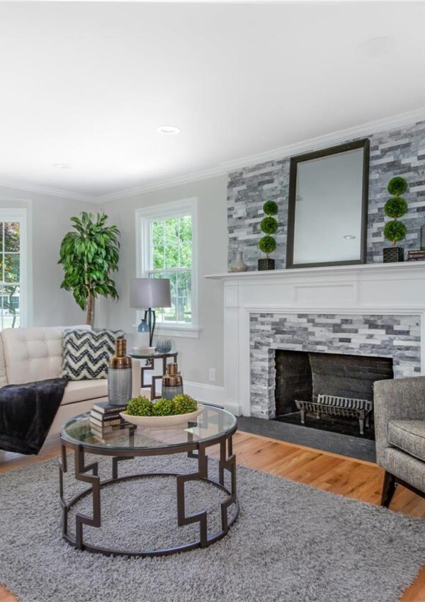 This is a living room remodel with a stone fireplace in Kirkwood, Missouri